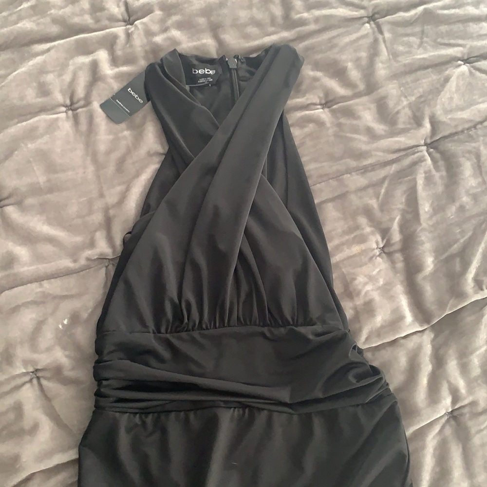 Bebe small black criss cross body suit , zip back , key hole front